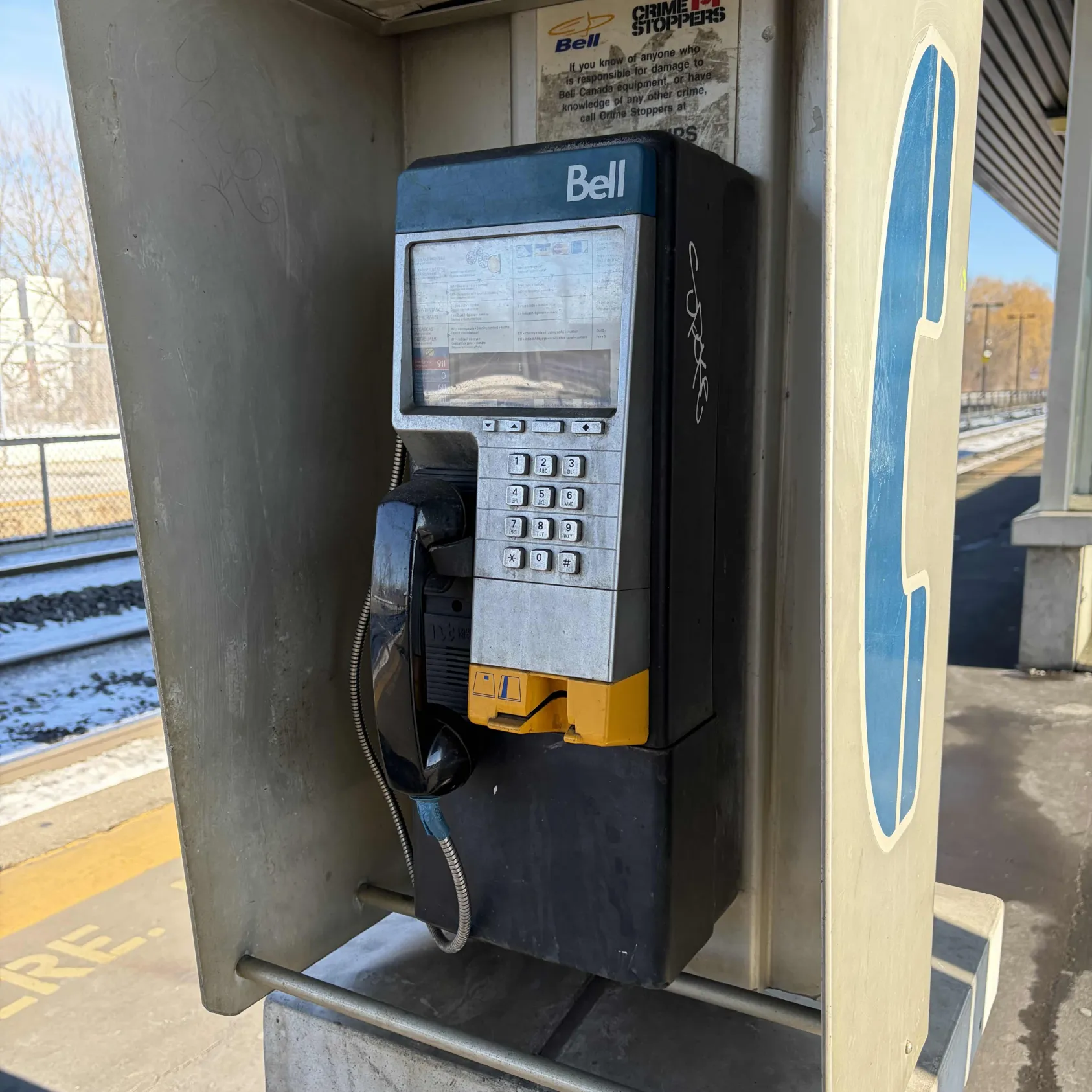 Clicking the digits of a payphone.