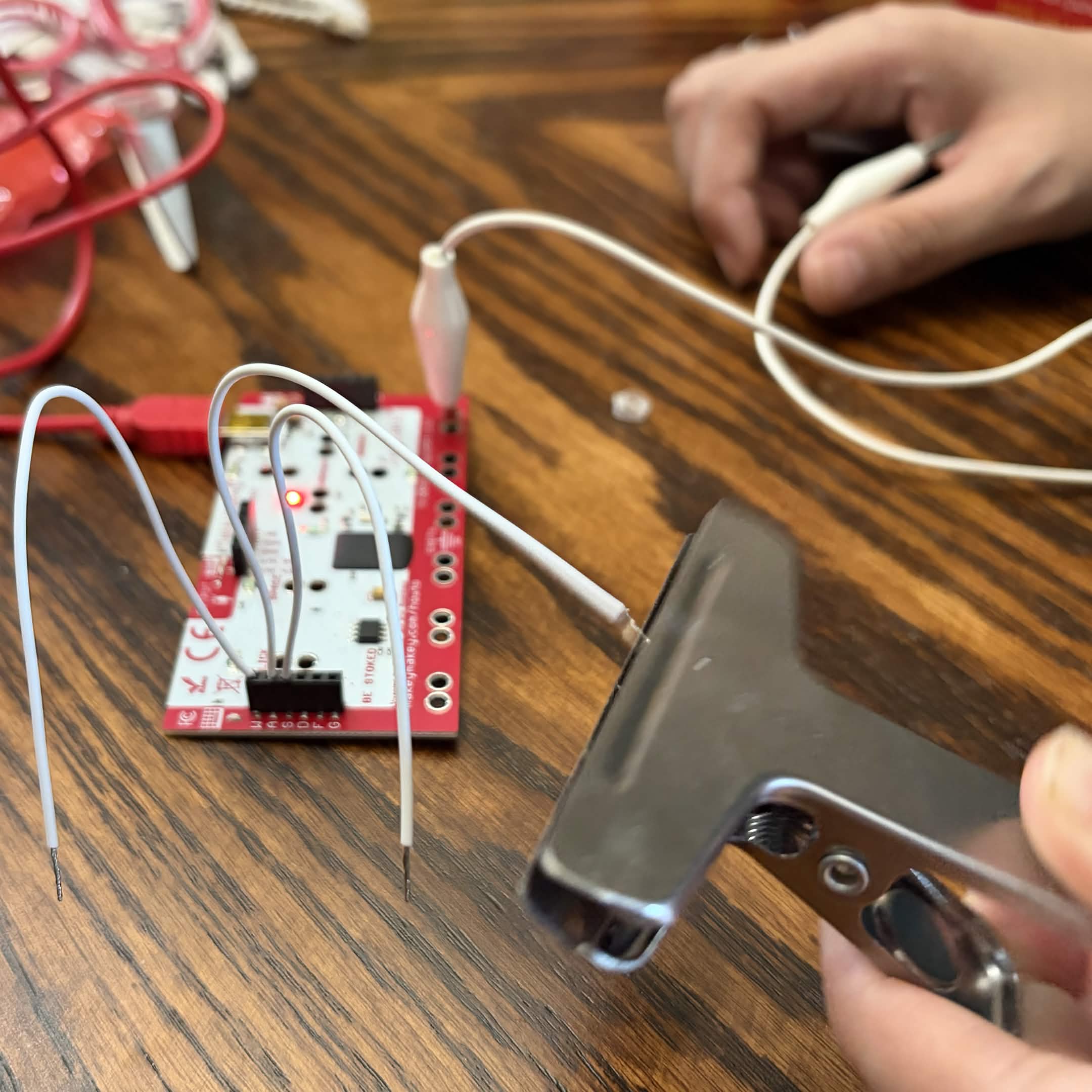 Experimenting with the backside of the Makey Makey with a clip as an input and the ground on self.