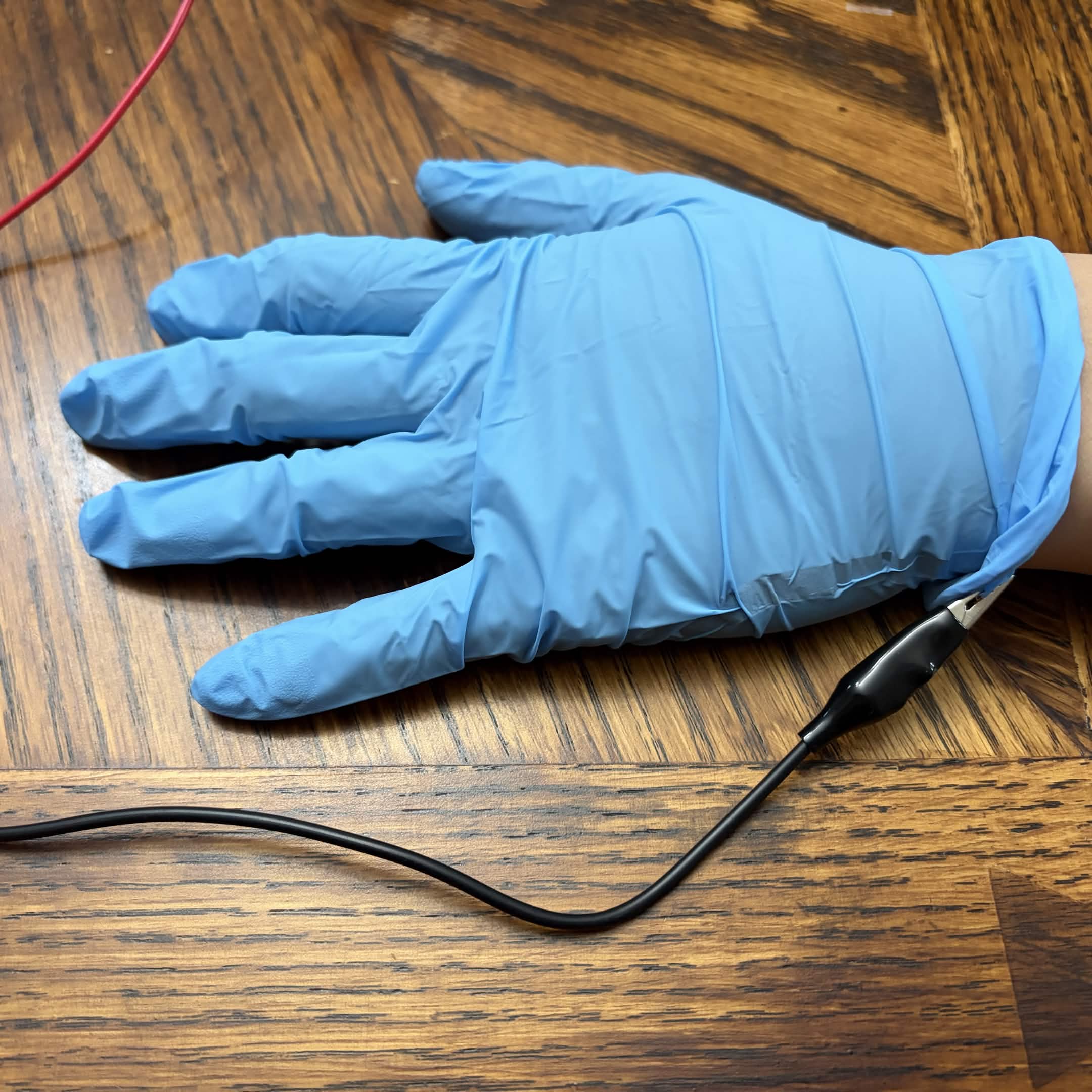Trying out a glove as a ground. Conductive tape is inside on the side.