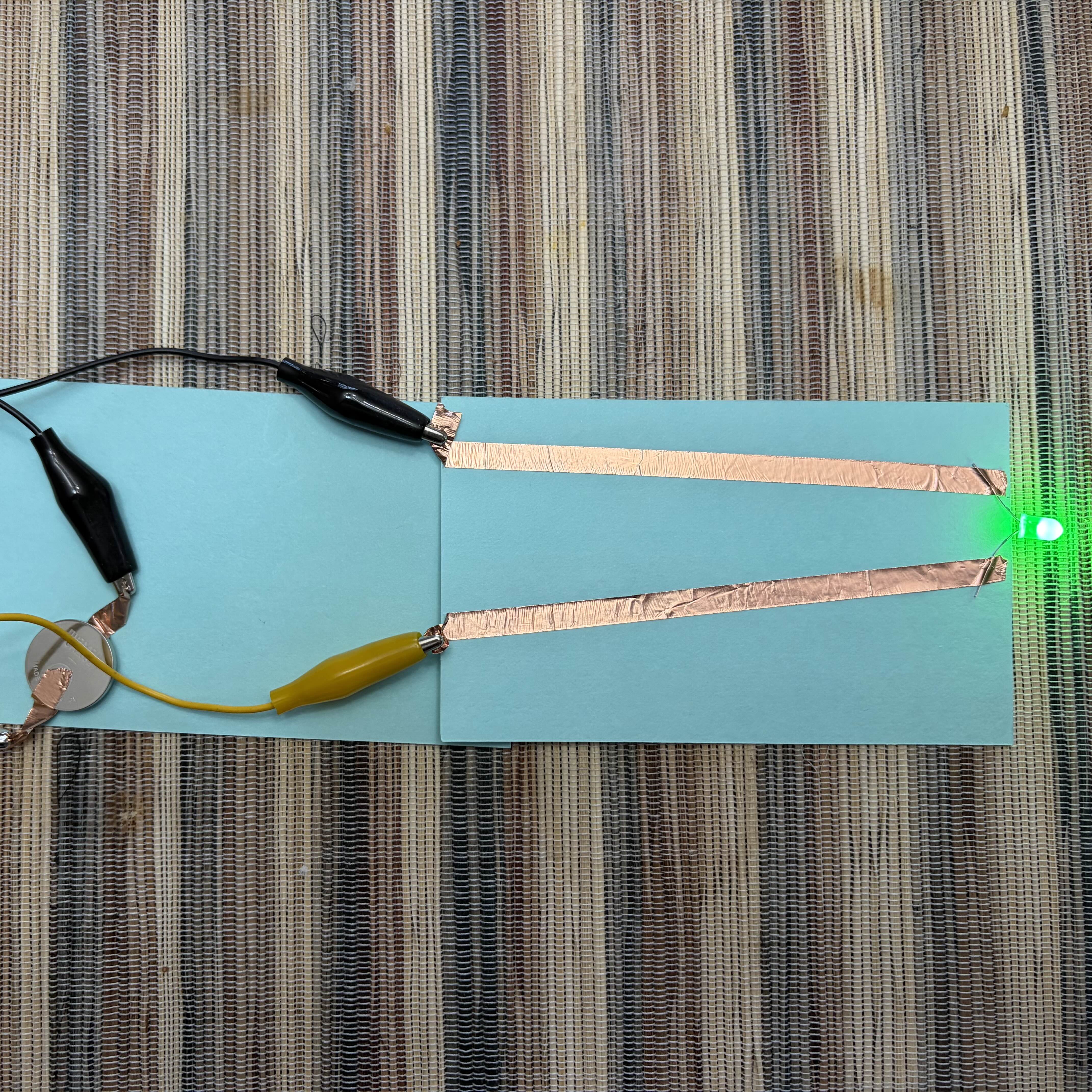 Trying out the parallel circuit with alligator clips connected to conductive tape