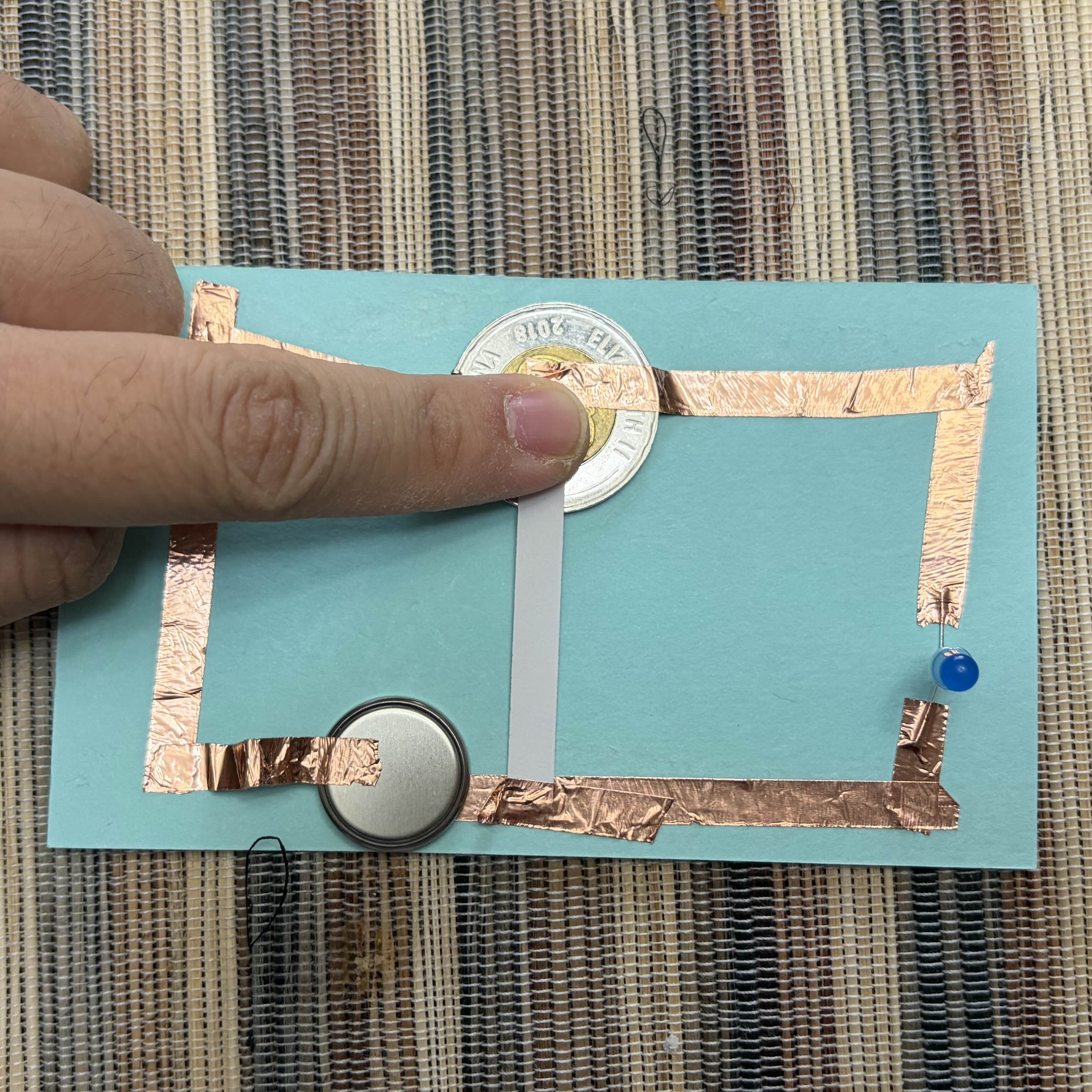 Adding a switch to make the light turn off (Pressing the white tab adds resistance)