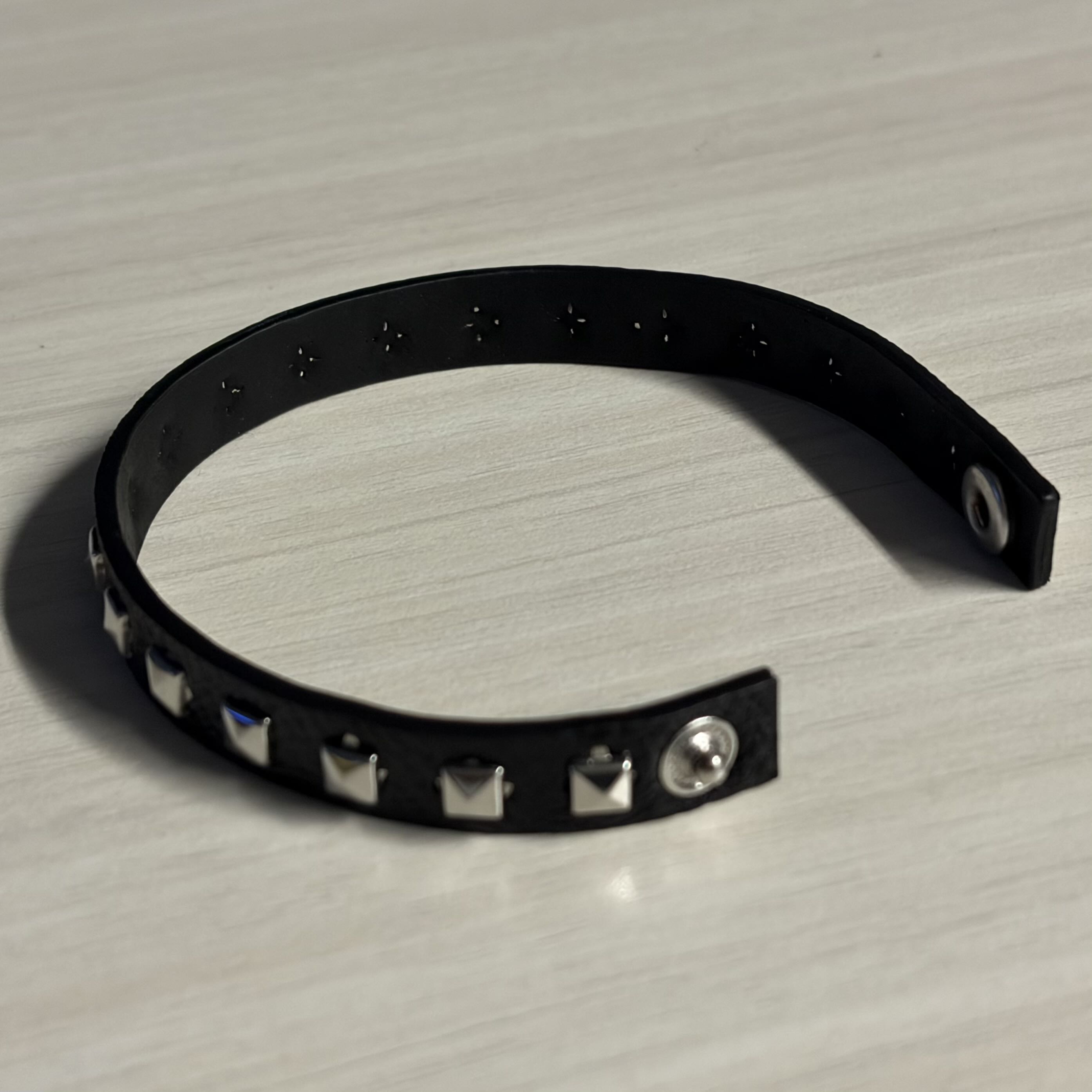 The back view of the bracelet. The circuit would be connected with conductive tape at the back side of the
                bracelet.